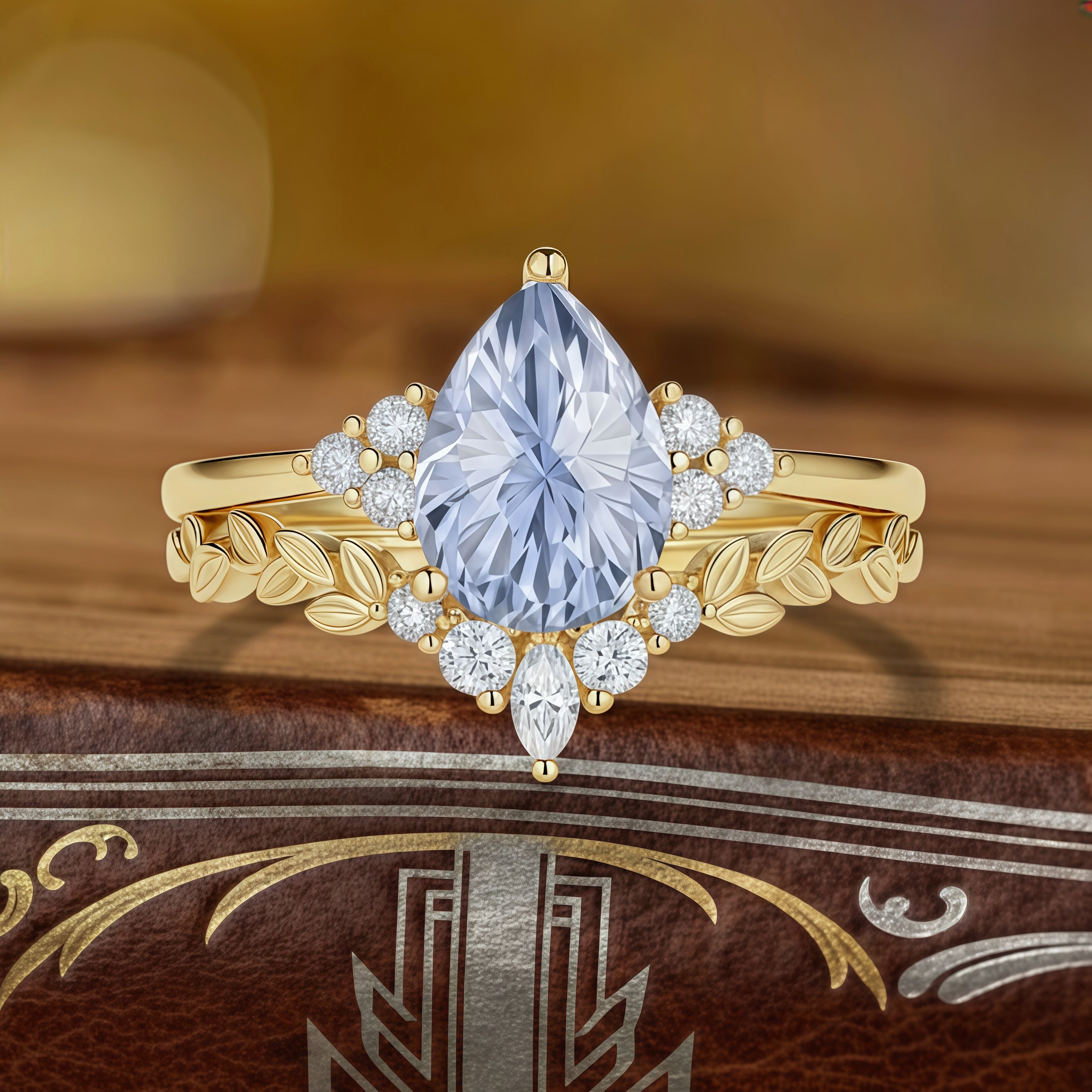 Lunaria – Pear Cut Lab Cornflower Blue Sapphire Leaf Band Engagement Ring