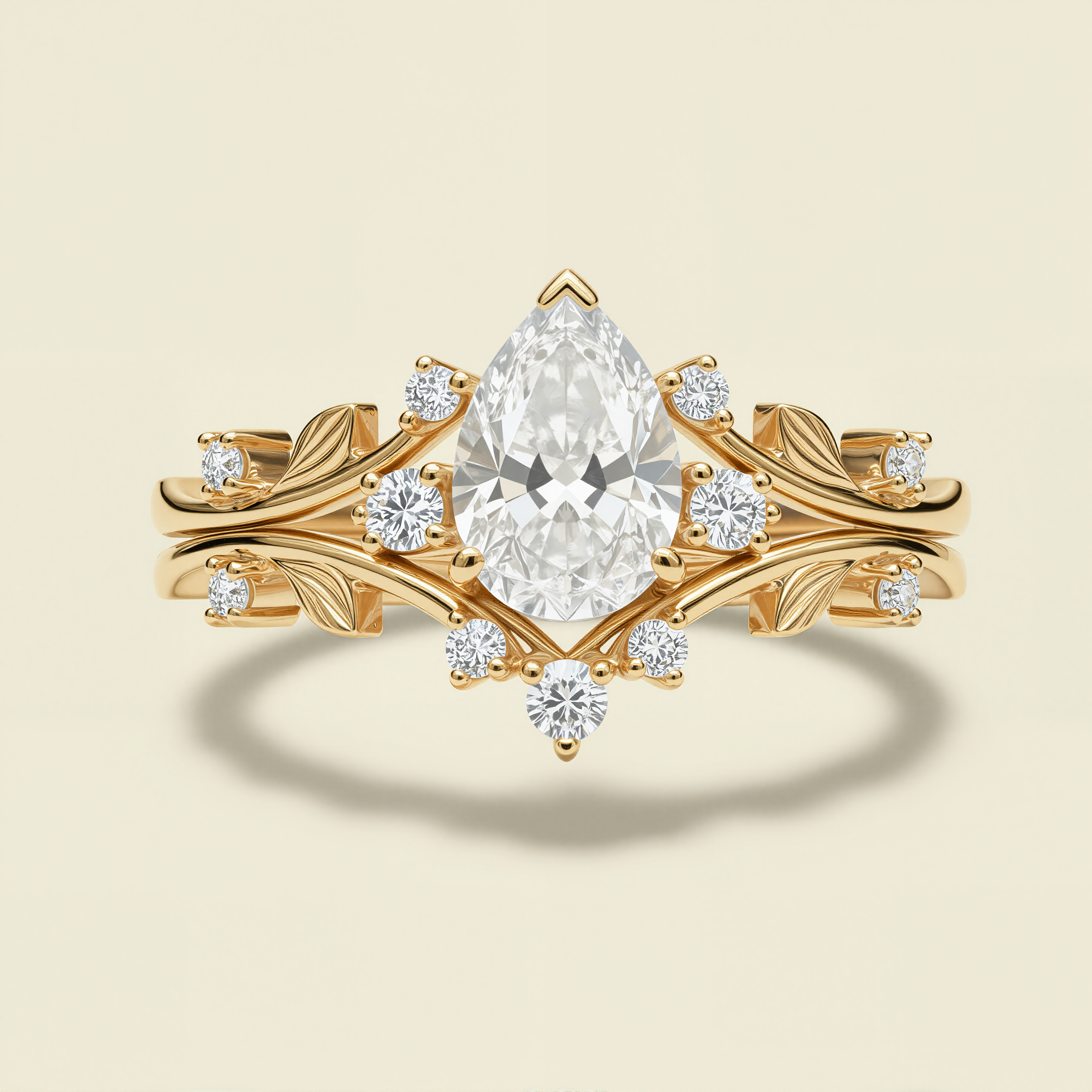 Golden Leaf Crown – Pear Cut Diamond Ring with Nature-Inspired Band